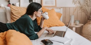 A photo showing a calm lady working at her own phase