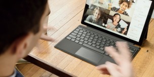 A photo showing a man having a remote meeting