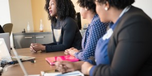 A photo of a young employee speaking at work