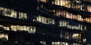 A photo of a corporate buidling's exterior at night