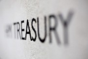 The HM Treasury name is seen painted on the outside of Britain's Treasury building in central London February 23, 2013.