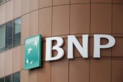 The logo of BNP Paribas is seen on top of the bank's building in Fontenay-sous-Bois, eastern Paris, May 30, 2014.