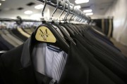 Suits hang on a rack at a Men's Wearhouse store in Pasadena, California June 25, 2013.