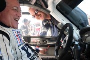 Leo Hindery, left, inspects his YES Network Porsche 911 GT3