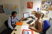Christopher (L), a 24-year-old unemployed Frenchman, talks with a career adviser at a local agency for employment as he looks for a job in Marseille June 17, 2013. Once a month Christopher meets with 