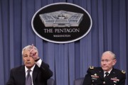 U.S. Secretary of Defense Chuck Hagel (L) speaks during a joint news conference with Joint Chiefs of Staff General Martin Dempsey at the Pentagon in Washington March 17, 2013.
