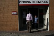 People stand in a government-run employment office in Madrid July 25, 2013. REUTERS-Juan Medina