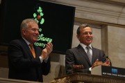 Disney CEO Bob Iger (R) rings the Closing Bell at the New York Stock Exchange