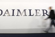 A shareholder arrives to a Daimler AG annual shareholder meeting in Berlin, April 4, 2012.