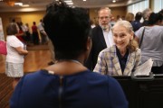 Job seeker Claire Bergin, 69, speaks with a potential employer at a job fair on September 13, 2016 in Hartford, Connecticut.