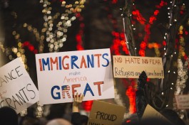 Slogan Showing Immigrants Helping Americans