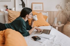 A photo showing a calm lady working at her own phase