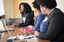 A photo of a young employee speaking at work