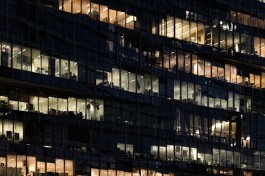 A photo of a corporate buidling's exterior at night