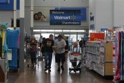 Customers shop at a Walmart Supercenter in Rogers, Arkansas June 6, 2013.